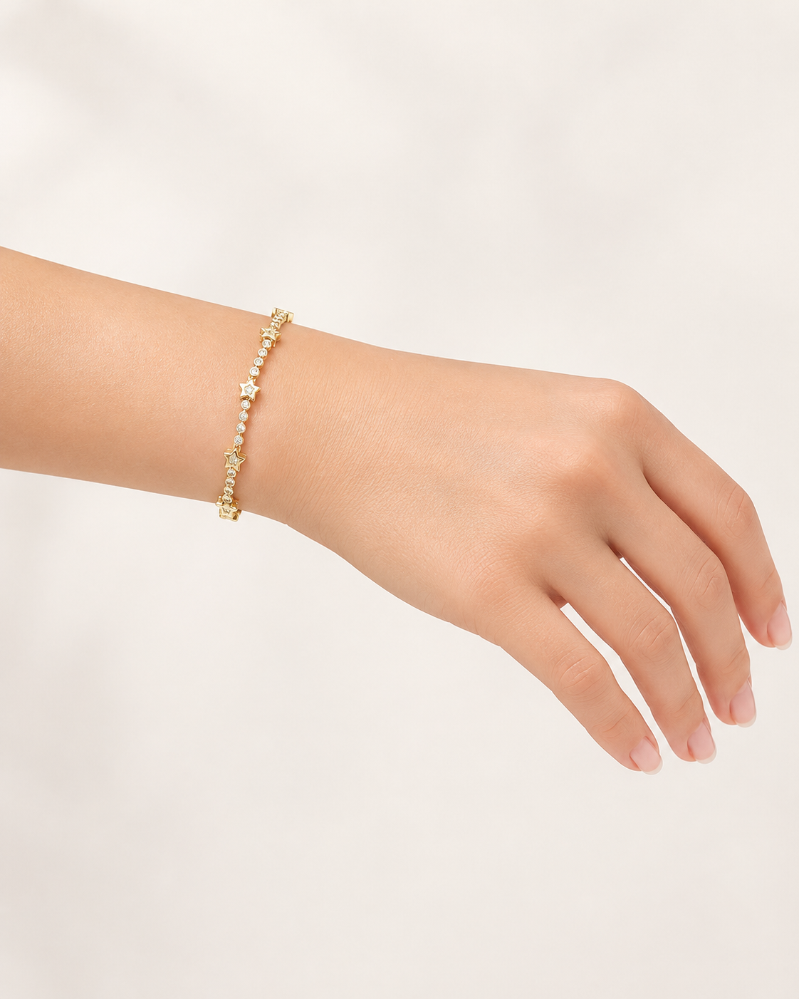Gold-Tone Brass Star Charm Tennis Bracelet with Crystal Accents