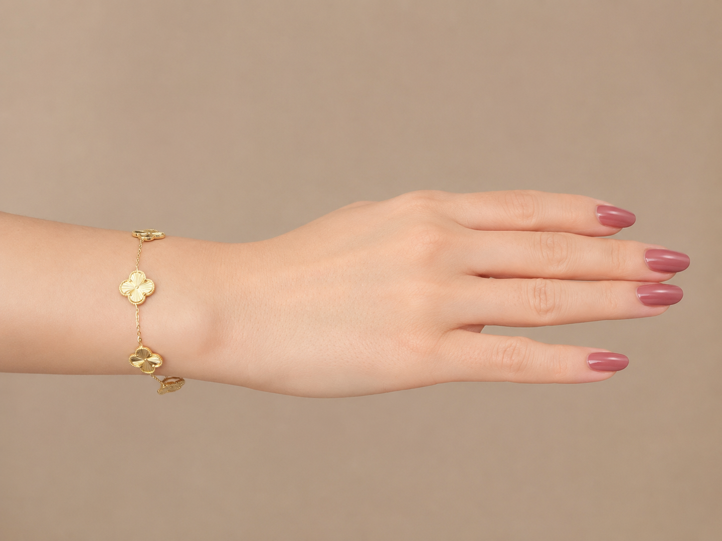 Gold-Tone Brass Four-Leaf Clover Bracelet with Textured Charms
